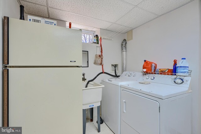 laundry room with washer and dryer and laundry area