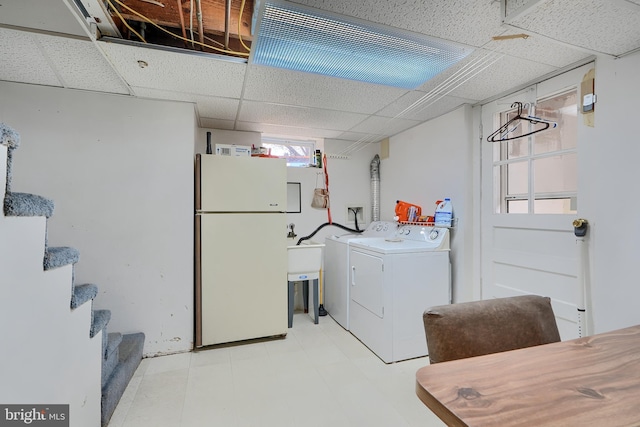 laundry area featuring washer and dryer and light floors