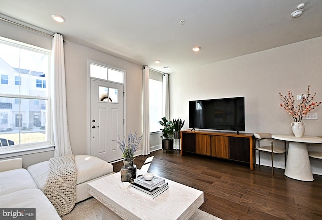 living room with recessed lighting, baseboards, and hardwood / wood-style floors