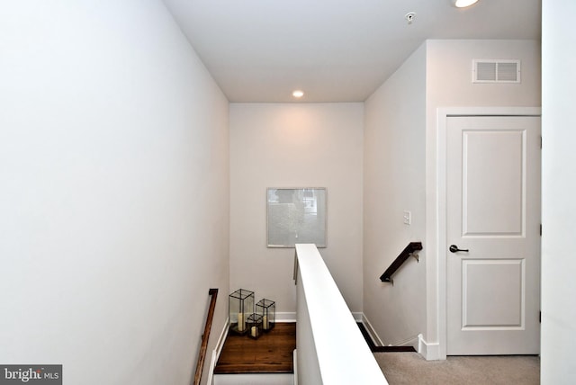 stairway with carpet, recessed lighting, baseboards, and visible vents