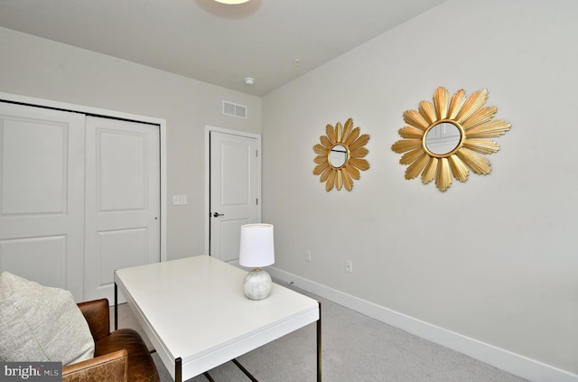 home office with baseboards, visible vents, and dark colored carpet