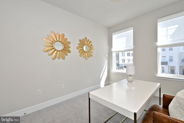 home office featuring carpet flooring and baseboards