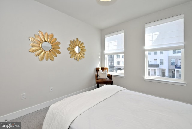 carpeted bedroom with baseboards