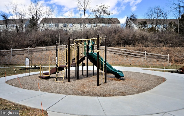 community jungle gym featuring fence