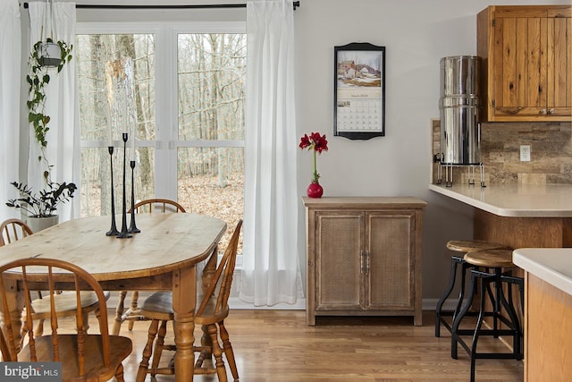 dining area featuring light wood-style flooring