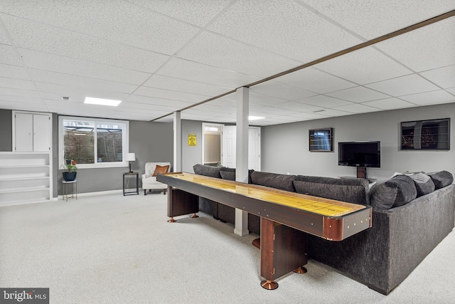 recreation room with carpet and a drop ceiling