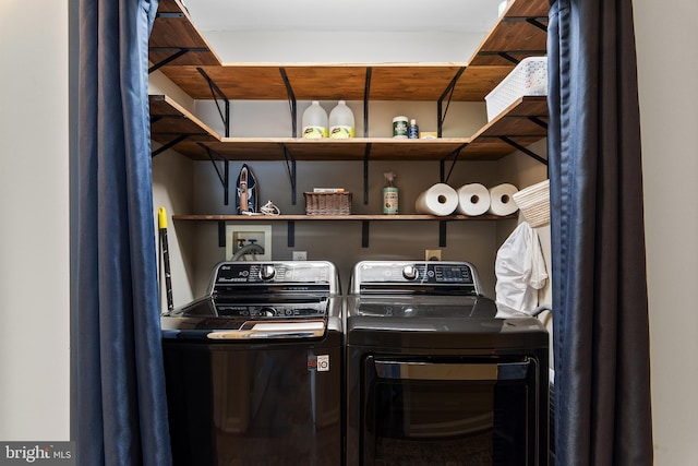 washroom featuring independent washer and dryer and laundry area