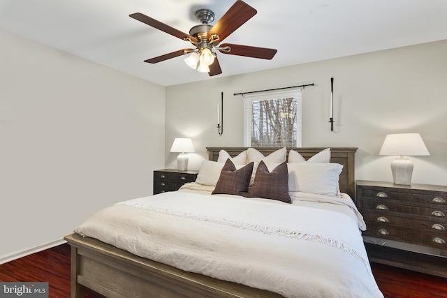 bedroom with dark wood-style floors and ceiling fan