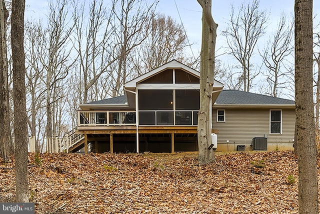 back of property featuring crawl space, central AC, stairs, and a sunroom