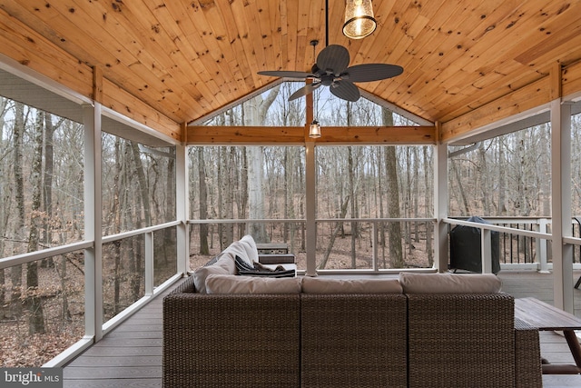 unfurnished sunroom with wood ceiling, ceiling fan, and vaulted ceiling