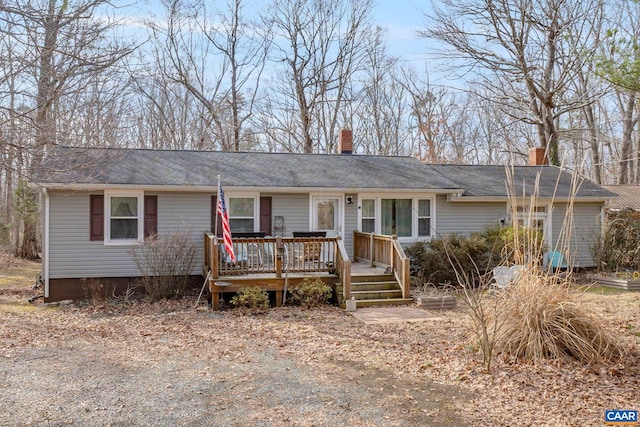 single story home featuring a wooden deck