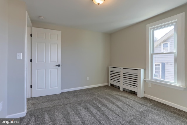 unfurnished bedroom featuring baseboards and carpet floors