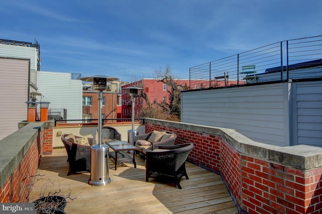 wooden terrace featuring an outdoor hangout area