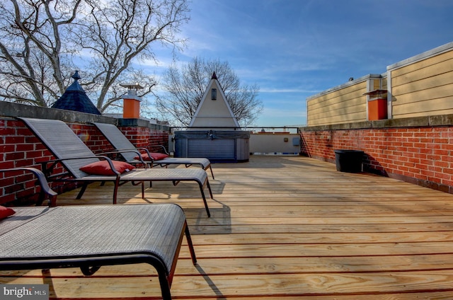 deck with a hot tub