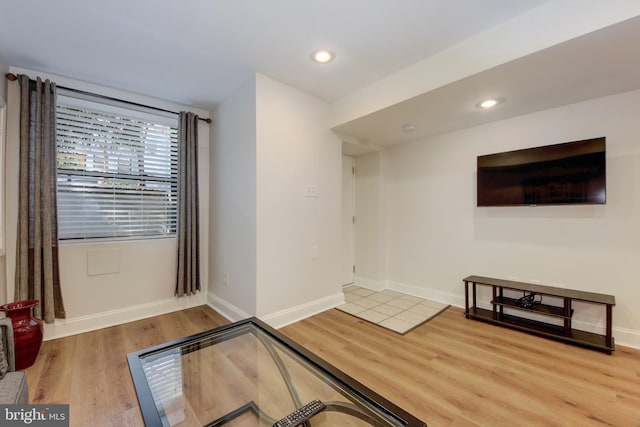 workout area with recessed lighting, wood finished floors, and baseboards