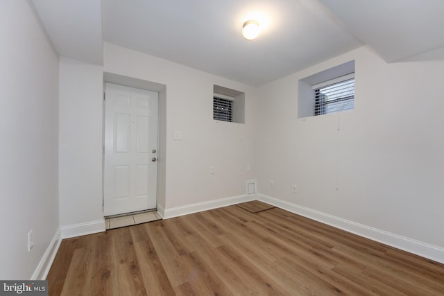 unfurnished room featuring light wood-type flooring and baseboards