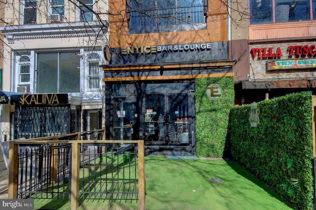 doorway to property featuring fence