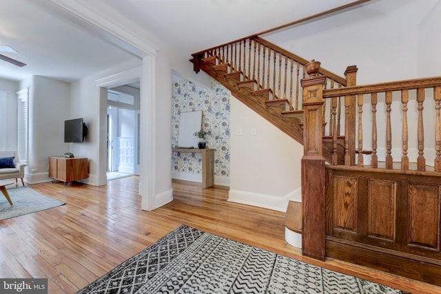 stairway with baseboards and wood-type flooring