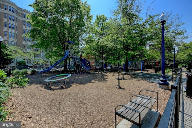 community jungle gym featuring fence