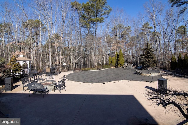 details with an outdoor fire pit and fence