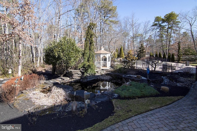 view of yard with a gazebo and fence