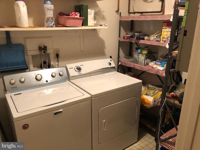 laundry area featuring laundry area and washing machine and dryer