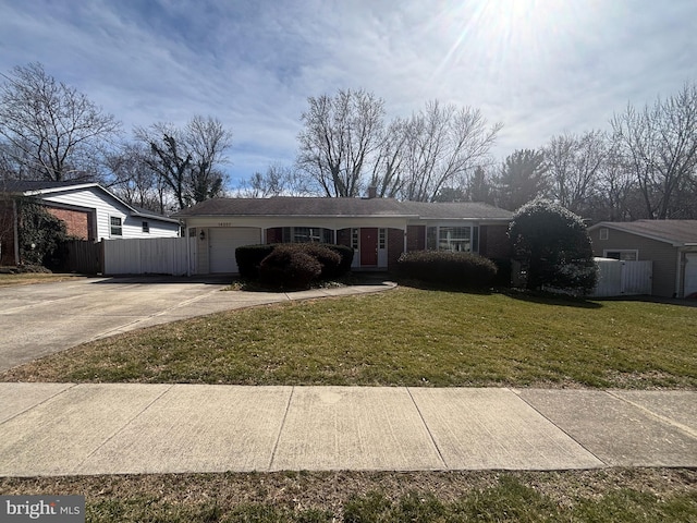 ranch-style house with a garage, driveway, a front lawn, and fence