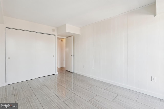 unfurnished bedroom featuring a closet