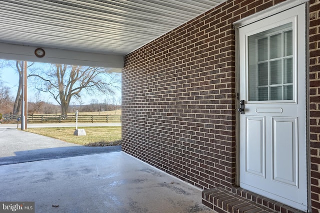 entrance to property with brick siding