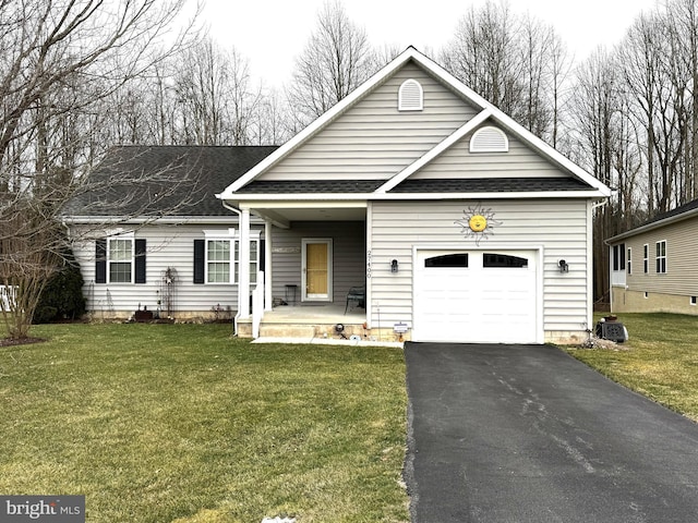 view of front of house featuring a front lawn, aphalt driveway, covered porch, an attached garage, and a shingled roof