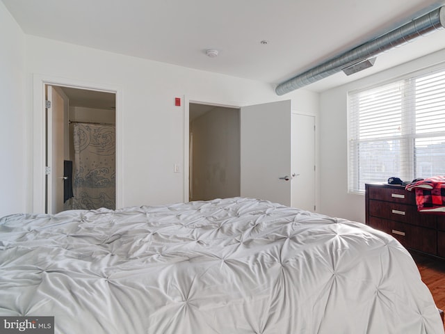 bedroom featuring wood finished floors