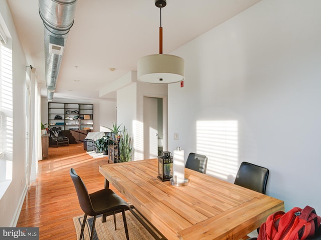 dining space featuring light wood finished floors