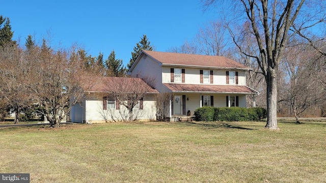 view of front facade featuring a front lawn and a garage