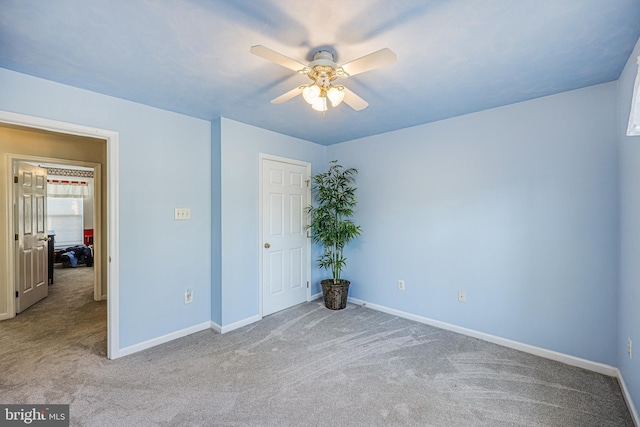 unfurnished bedroom featuring carpet flooring, ceiling fan, and baseboards