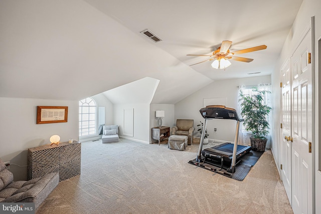 exercise area with vaulted ceiling, a wealth of natural light, visible vents, and carpet floors