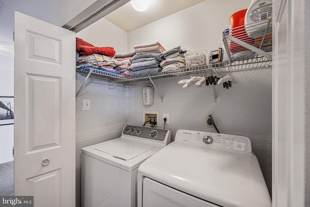 laundry room featuring washer and dryer and laundry area