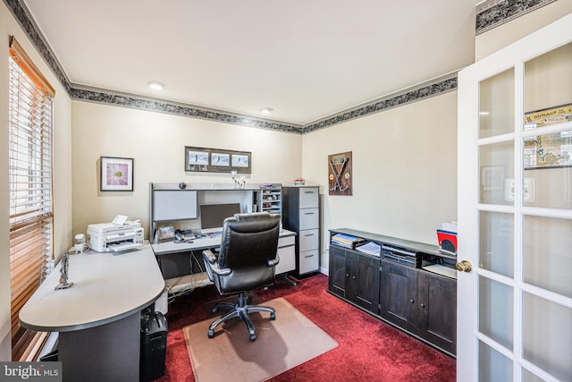 office area with crown molding and dark carpet