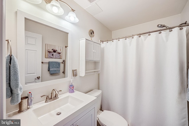 bathroom with a shower with shower curtain, toilet, and vanity