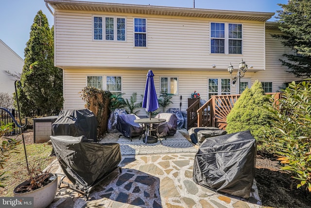 rear view of property with a patio area