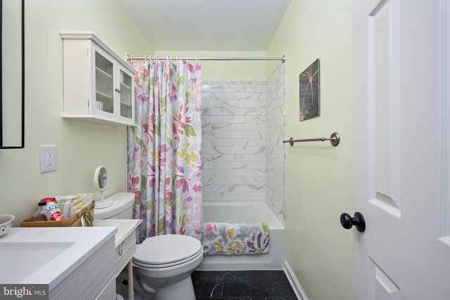 full bathroom with vanity, toilet, shower / tub combo, and baseboards