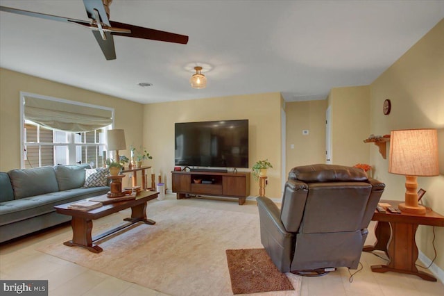 living area featuring ceiling fan