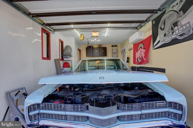 garage with a garage door opener and a wall mounted AC