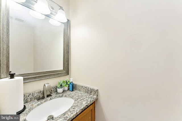 bathroom with vanity and visible vents