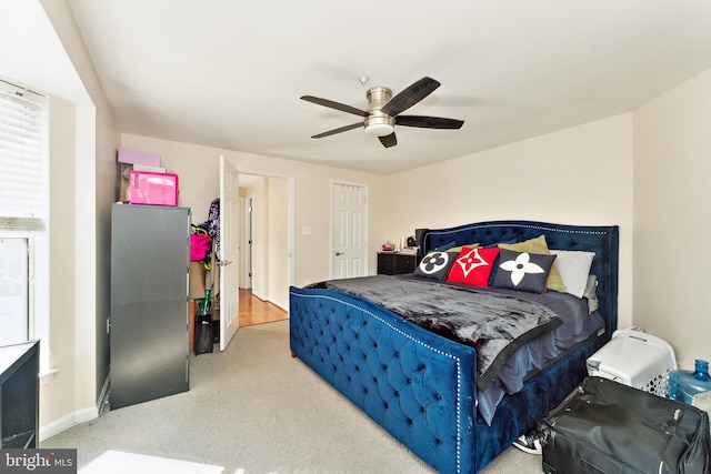 bedroom featuring baseboards and ceiling fan