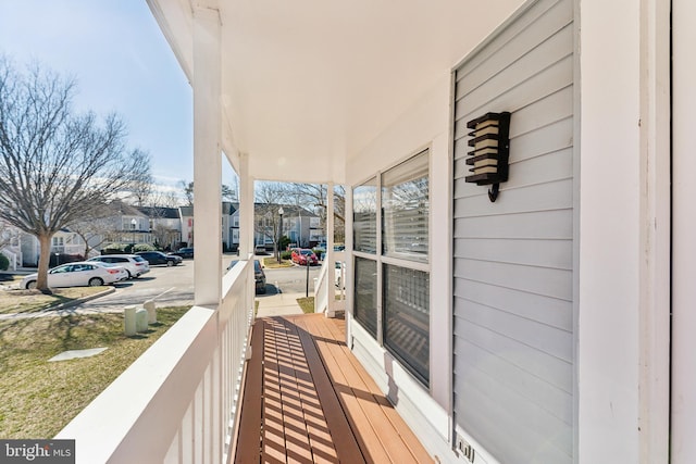 balcony with a residential view and covered porch