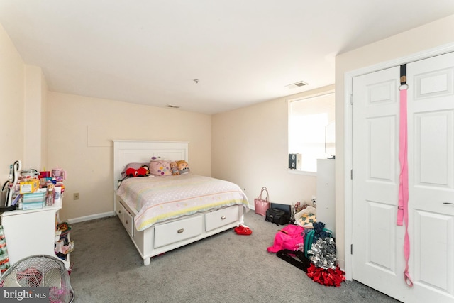 bedroom with visible vents and carpet flooring