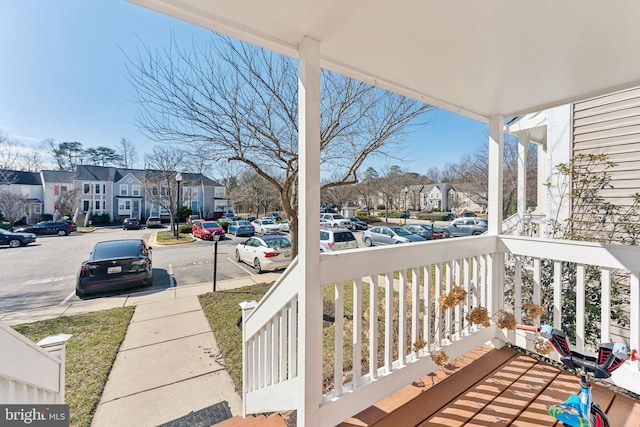 balcony featuring a porch and a residential view