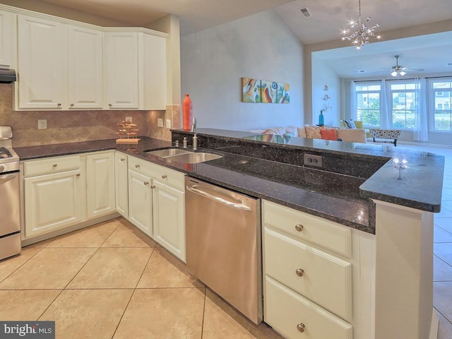 kitchen featuring visible vents, light tile patterned flooring, a sink, decorative backsplash, and dishwasher