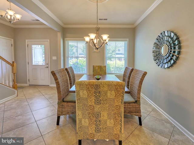 dining area featuring stairway, a notable chandelier, and ornamental molding