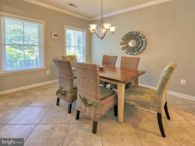 dining space featuring visible vents, baseboards, a chandelier, and crown molding